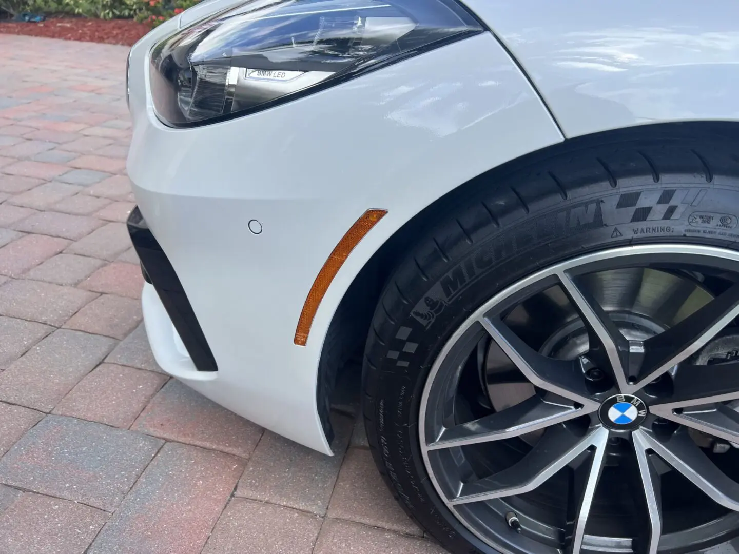 Close-up of a BMW car front wheel.