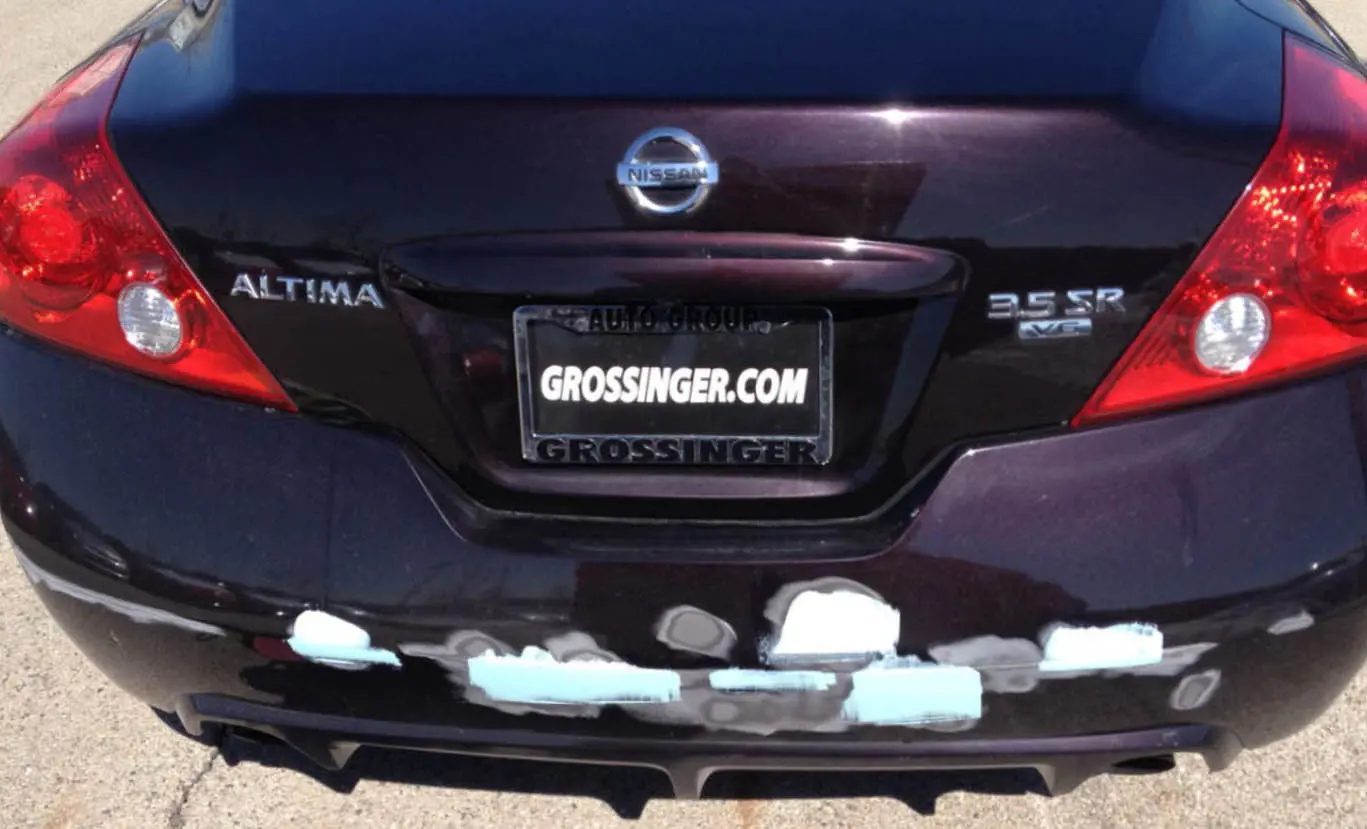 Rear view of a Nissan Altima with a Grossinger.com license plate frame.