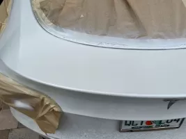 Car being prepared for paint job.